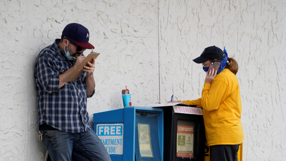 People who lost their jobs fill out paperwork to file for unemployment in Arkansas