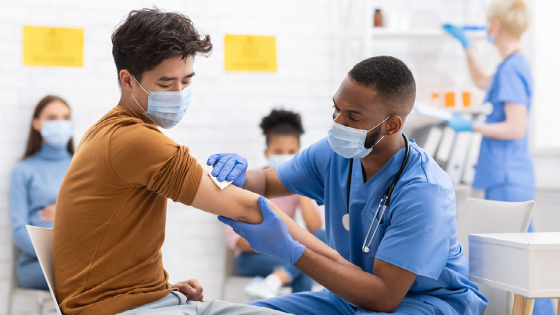 Person gets their COVID vaccine from nurse