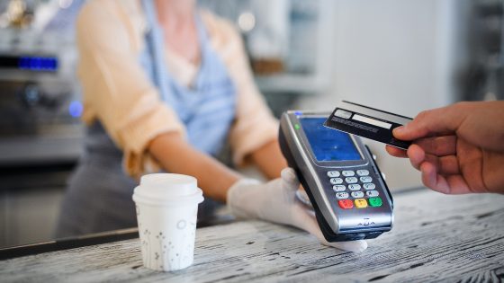 Person pays for coffee using card