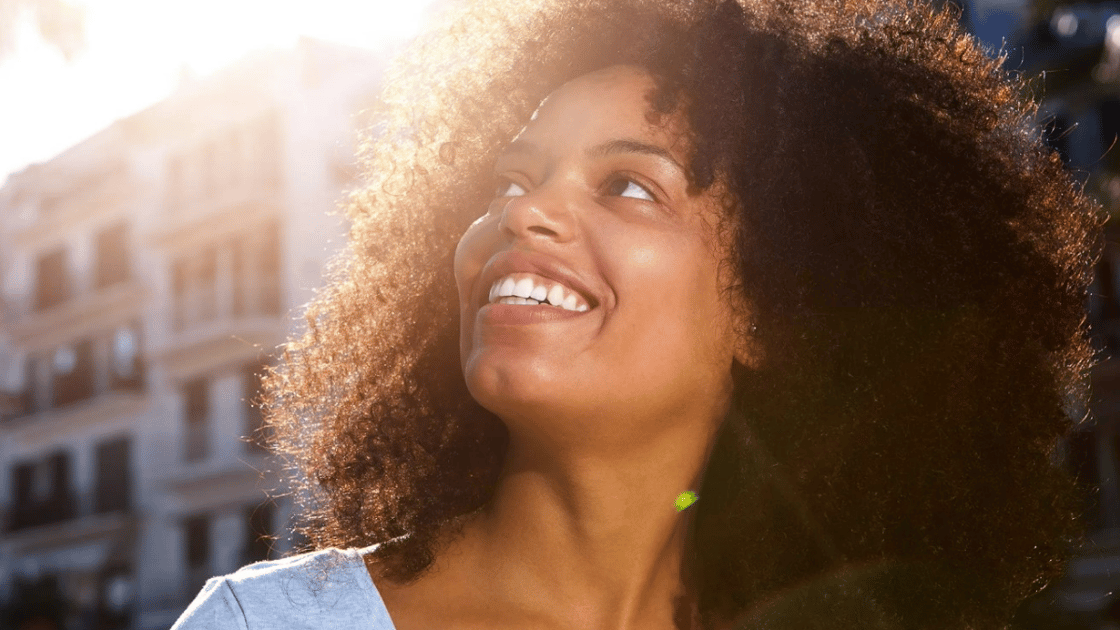 Person smiling on a sunny day