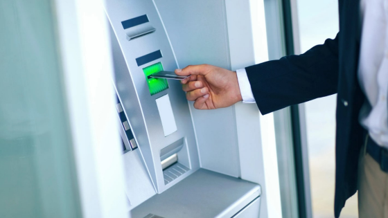 Person using ATM machine