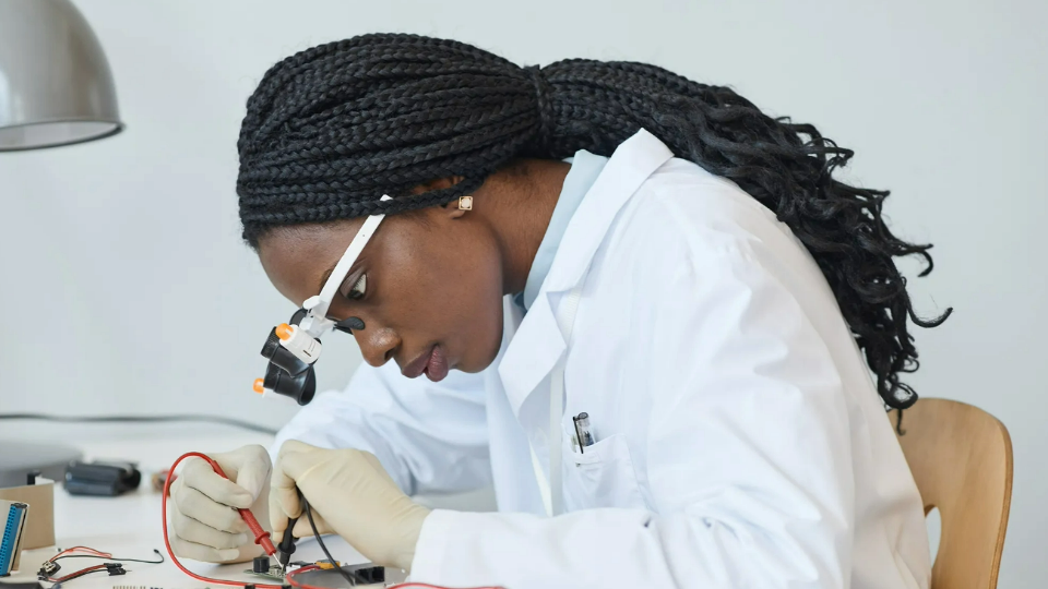 Person working in a lab with safety equipment on