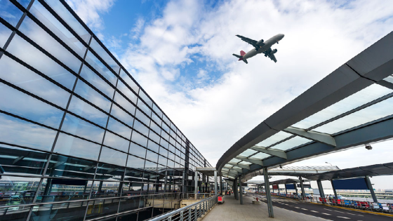 Plane flies over airport in Shanghai