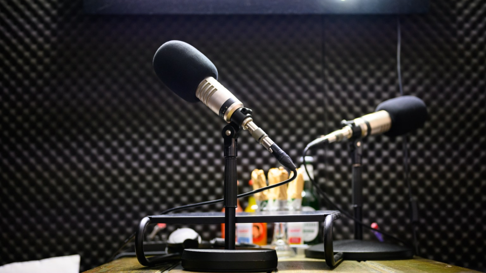 Podcast microphones stands in a recording studio on the premises of the company OMR.