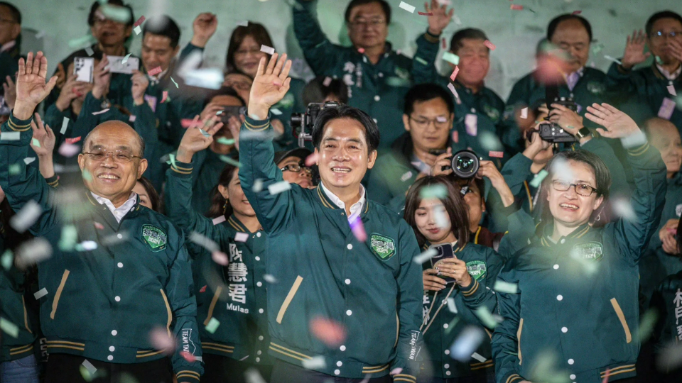 President-elect Lai Ching-te and Vice President-elect Hsiao Bi-khim wave to supporters after winning the election in Taipei