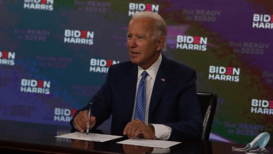 Presidential candidate Joe Biden signs documents for receiving the Democratic nomination