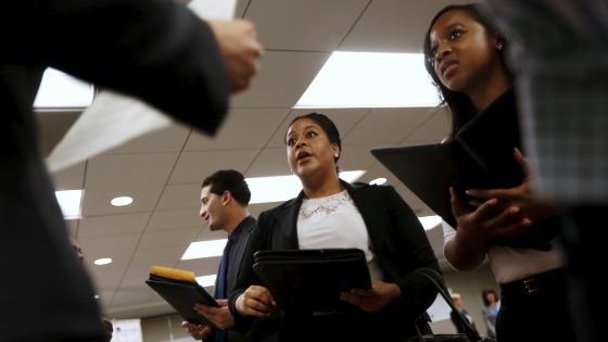 Prospective job seekers talking with employers