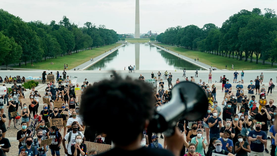 Protesters applaud during a rally against racial inequality in the aftermath of the death in Minneapolis police custody of George Floyd at the Lincoln Memorial in Washington