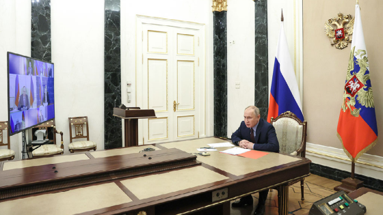 Putin is seen in his office in the Kremlin as he chairs a videoconference meeting of permanent members of the Russian Security Council