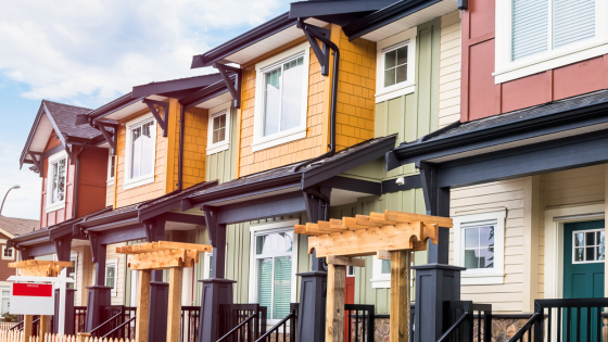 Row of houses with one on sale