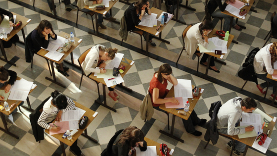 Rows of students taking test