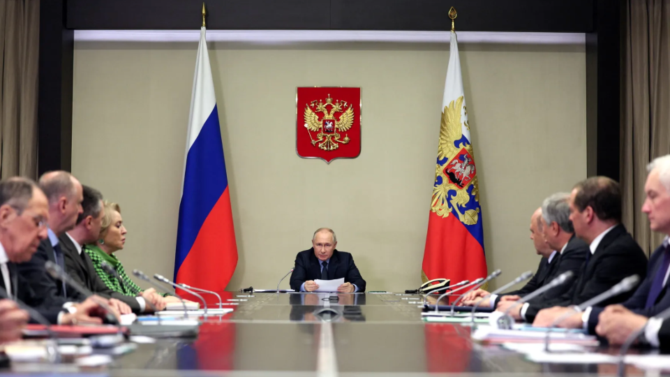 Russian President Vladimir Putin chairs a meeting of his security council and other government officials