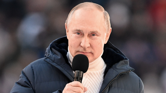 Russian President Vladimir Putin delivers a speech during a concert marking the eighth anniversary of Crimea annexation