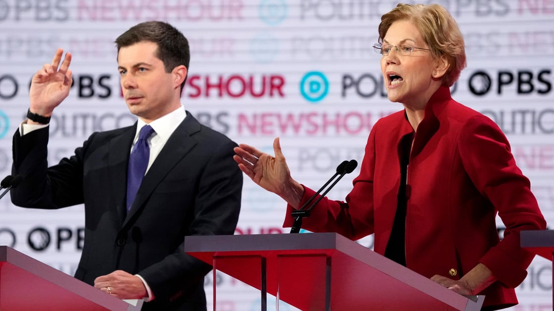 Senator Elizabeth Warren criticizes South Bend Mayor Pete Buttigieg as he seeks the ability to respond during the sixth 2020 U.S. Democratic presidential candidates 