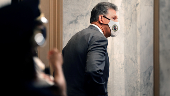 Senator Joe Manchin leaves the Capitol following debate on amendments to the bipartisan infrastructure bill