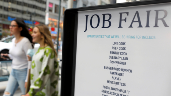 Signage for a job fair is seen on 5th Avenue