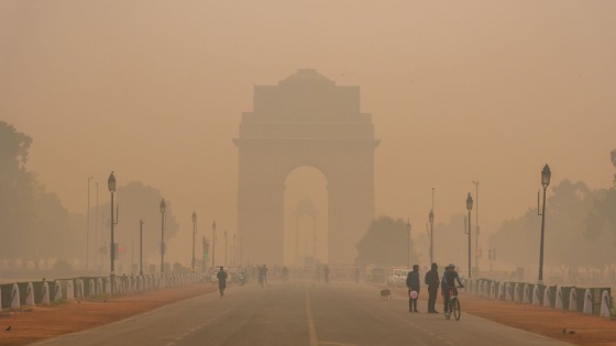 Silhouette of triumphal arch architectural style India Gate during hazy morning