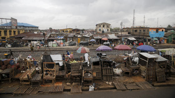 Slum houses are seen built along a train track in the Agege district in Lagos