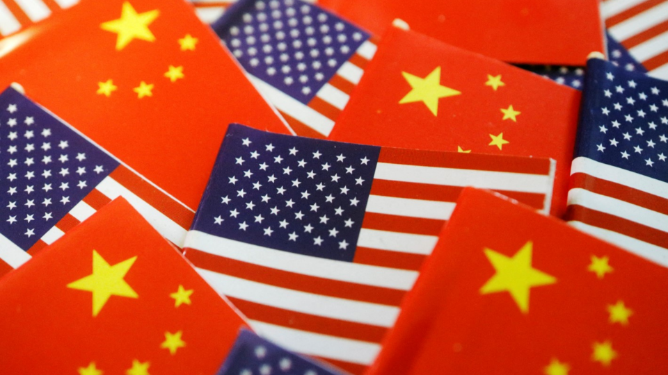 Small flags of U.S. and China scattered out
