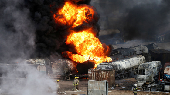 Smoke and flames rise from fuel trucks after an overnight attack by the Taliban on the outskirts of Kabul