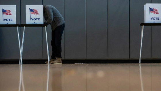 Steve Benavides votes inside the Cass Technical High School polling place in Detroit