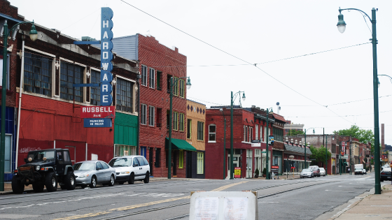 Street with hardware store and other retail store fronts