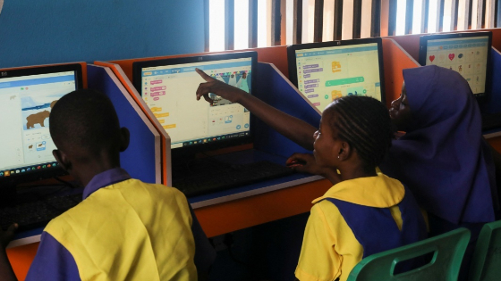 Students attend a computer class alongside other students in the area of Kuje, in Abuja, Nigeria.