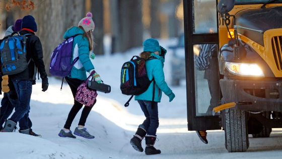 Students board their school bus in Minneapolis.