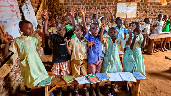 Students raising hands in class-1