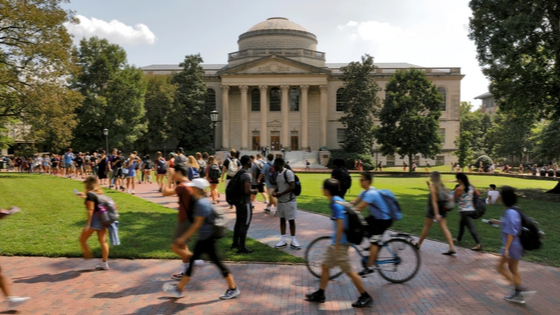 Students walk past Wilson Library on the campus of the University of North Carolina at Chapel Hill