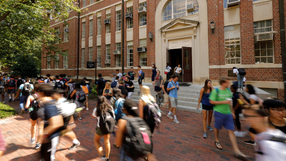 Students walk past a classroom building on the campus of the University of North Carolina at Chapel Hill