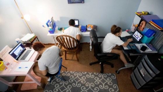 Students work on their laptops on the first day of school