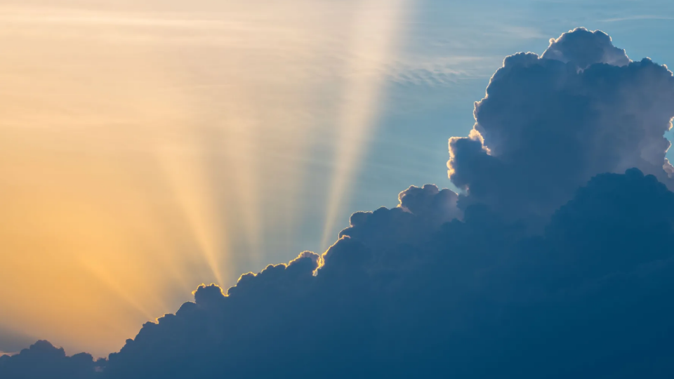 Sun peeks out behind clouds