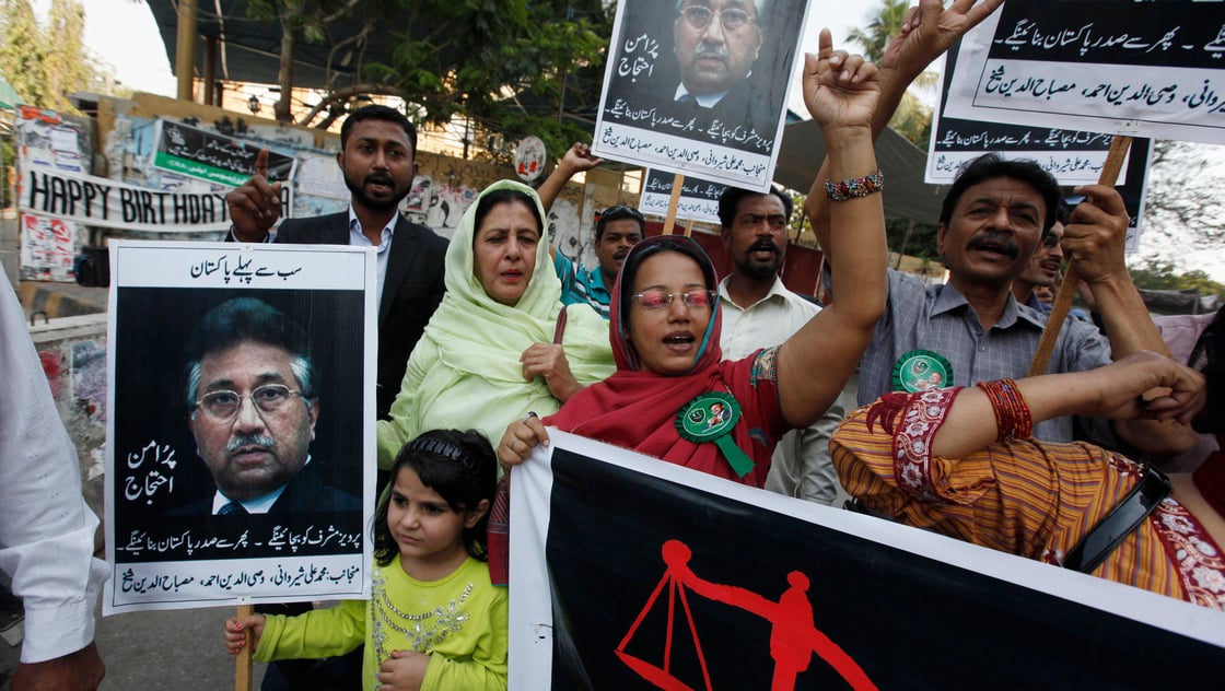 Supporters of former President Pervez Musharraf, head of the All Pakistan Muslim League (APML) political party, chant slogans during a protest demanding a fair trial for him in Karachi