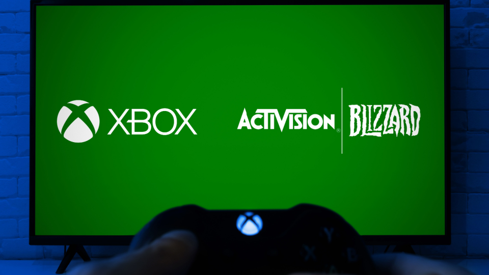 TV screen showing the Microsoft Xbox and Activision-Blizzard logos.