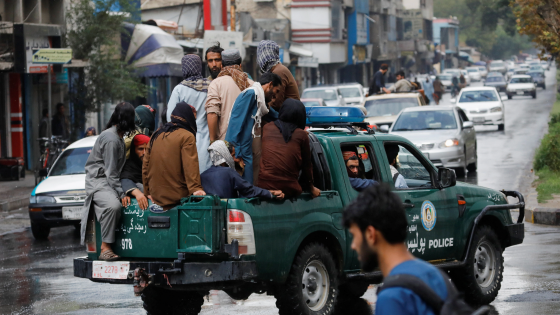 Taliban fighters drive a car on a street following the killing of Al Qaeda leader Ayman al-Zawahiri in a U.S. strike over the weekend