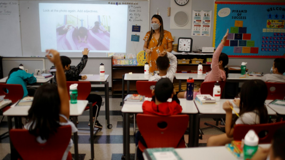 Teacher Mary Yi works with fourth grade students at the Sokolowski School