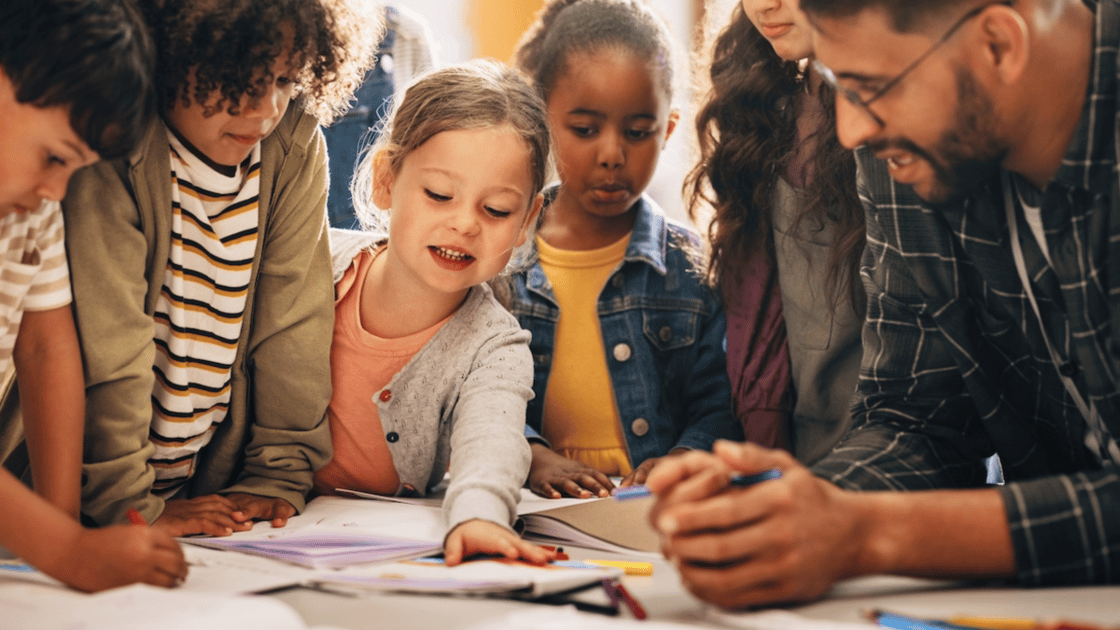 Teacher explaining concept to young students