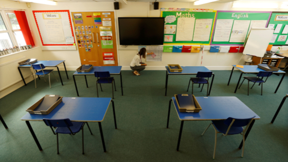 Teacher in an empty classroom