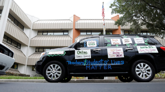 Teachers hold a car parade protest in front of the Pasco County School district office