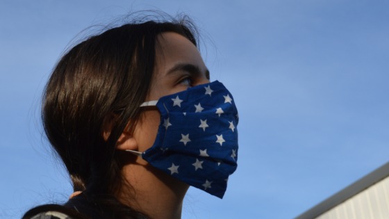 Teenage girl wearing mask