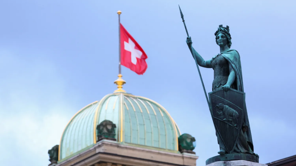 The Helvetia statue in front of the Swiss Parliament Building in Bern