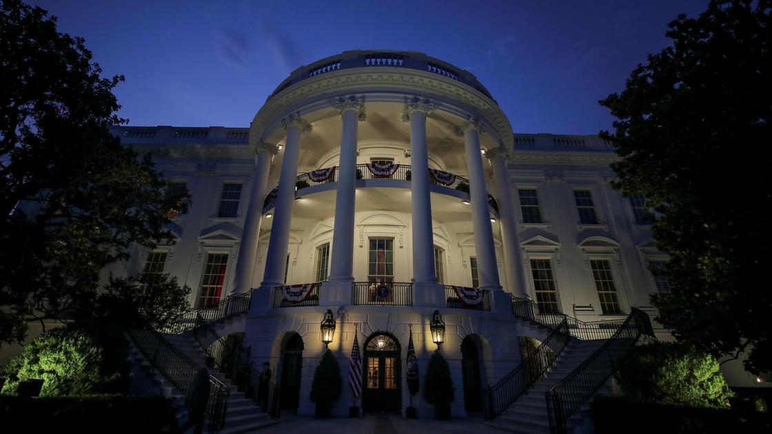 The South Portico and residence of the White House are illuminated