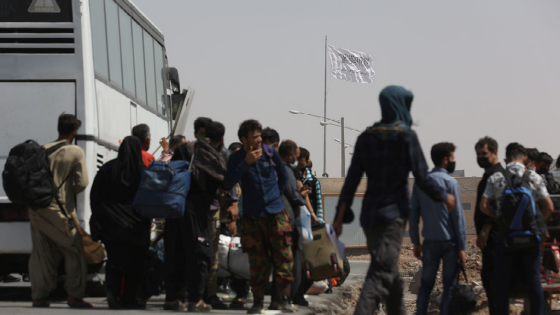 The flag of the Taliban is pictured from the Dowqarun border crossing between Iran and Afghanistan