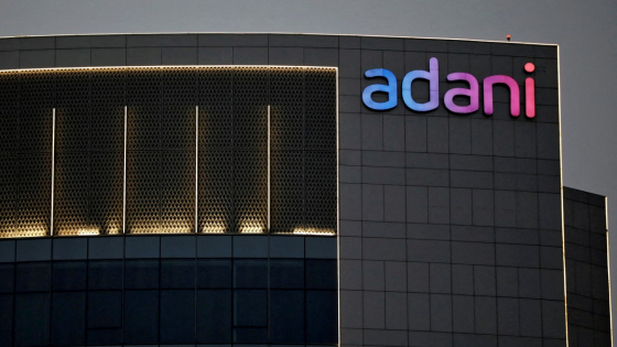 The logo of the Adani group is seen on the facade of one of its buildings on the outskirts of Ahmedabad