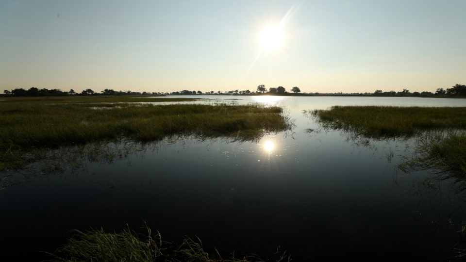 The sun sets over the Okavango Delta in Botswana