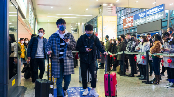 Travellers wear mask at airport to prevent infection from coronavirus.