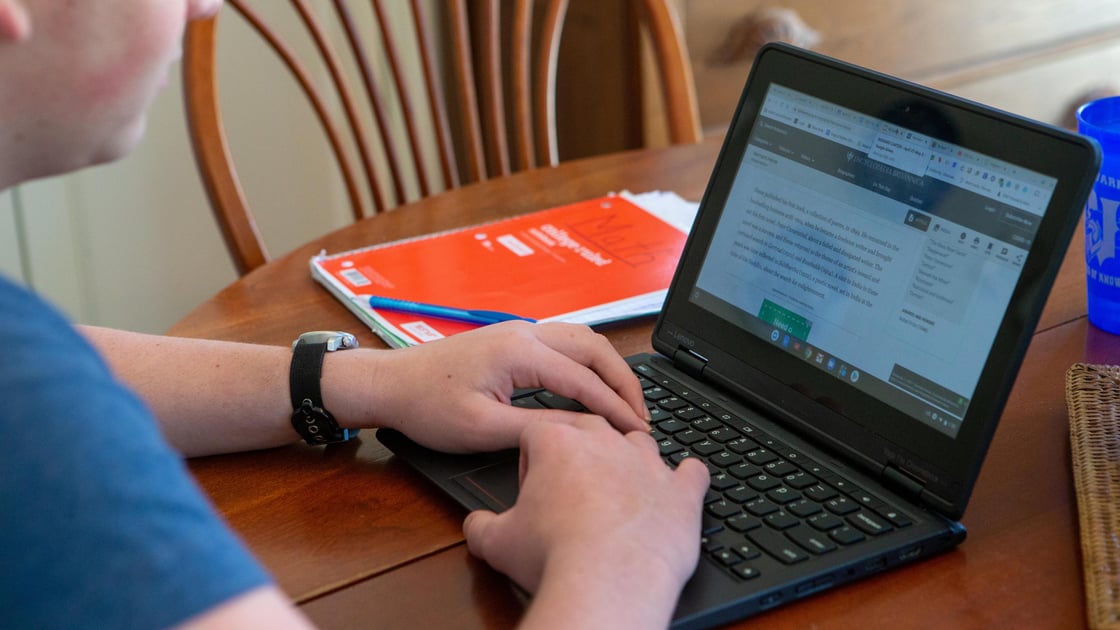 Trip Carter works on school work virtually at his home