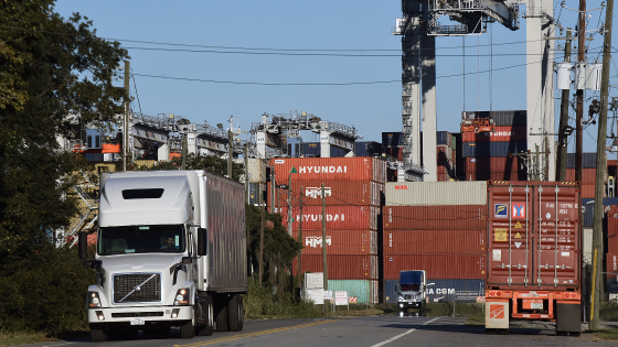 Trucks pick up shipping containers at the Port of Savannah in Georgia