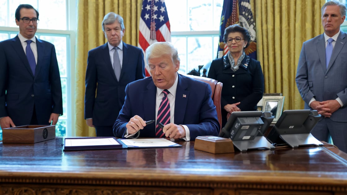 Trump caps his pen after signing the Paycheck Protection Program and Health Care Enhancement Act